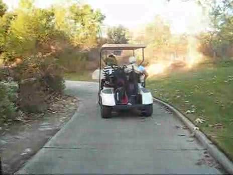 Woman Learning to Drive with Gold Cart